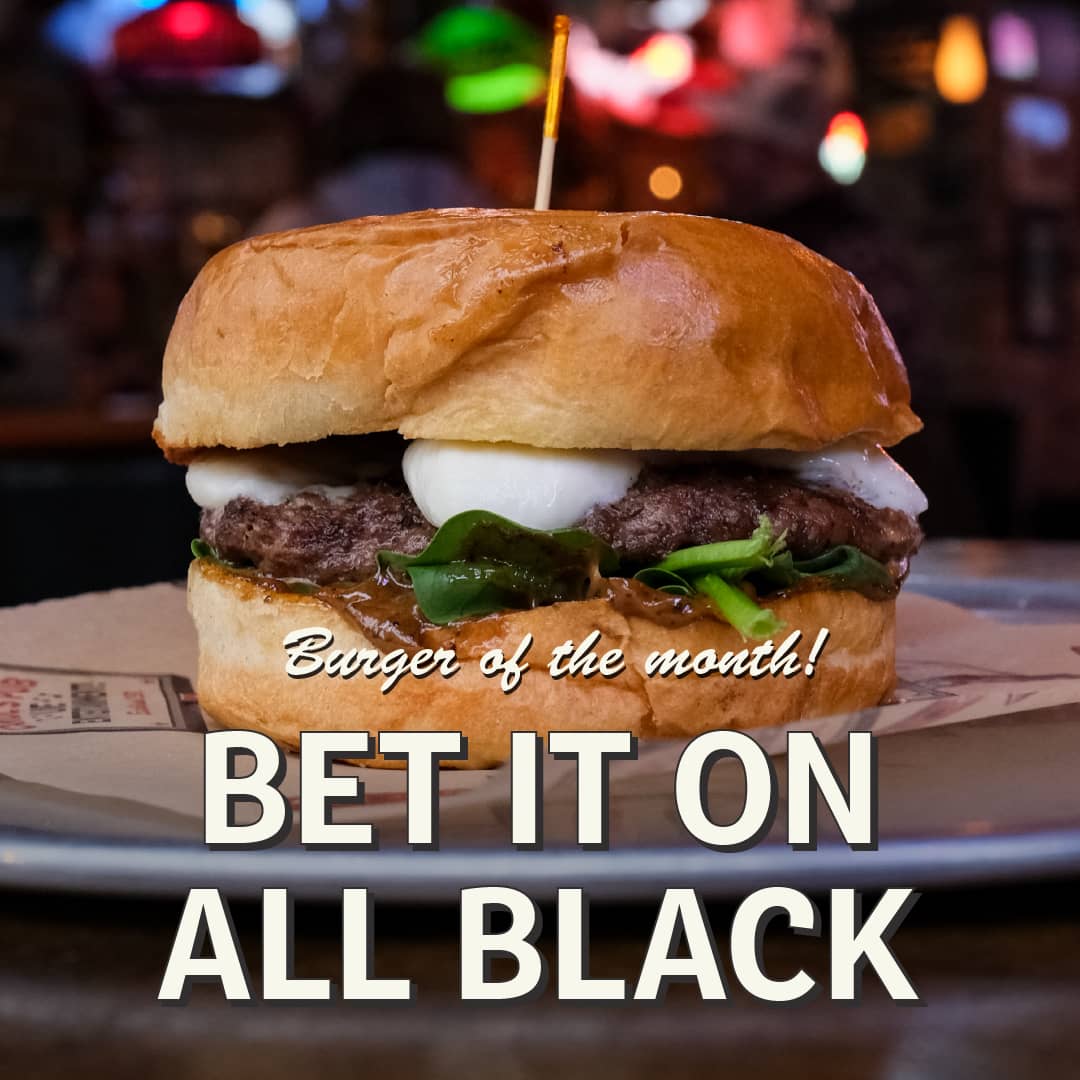 Promotional image for December's Burger of the Month at Carol's Pub: Bet It On All Black Burger